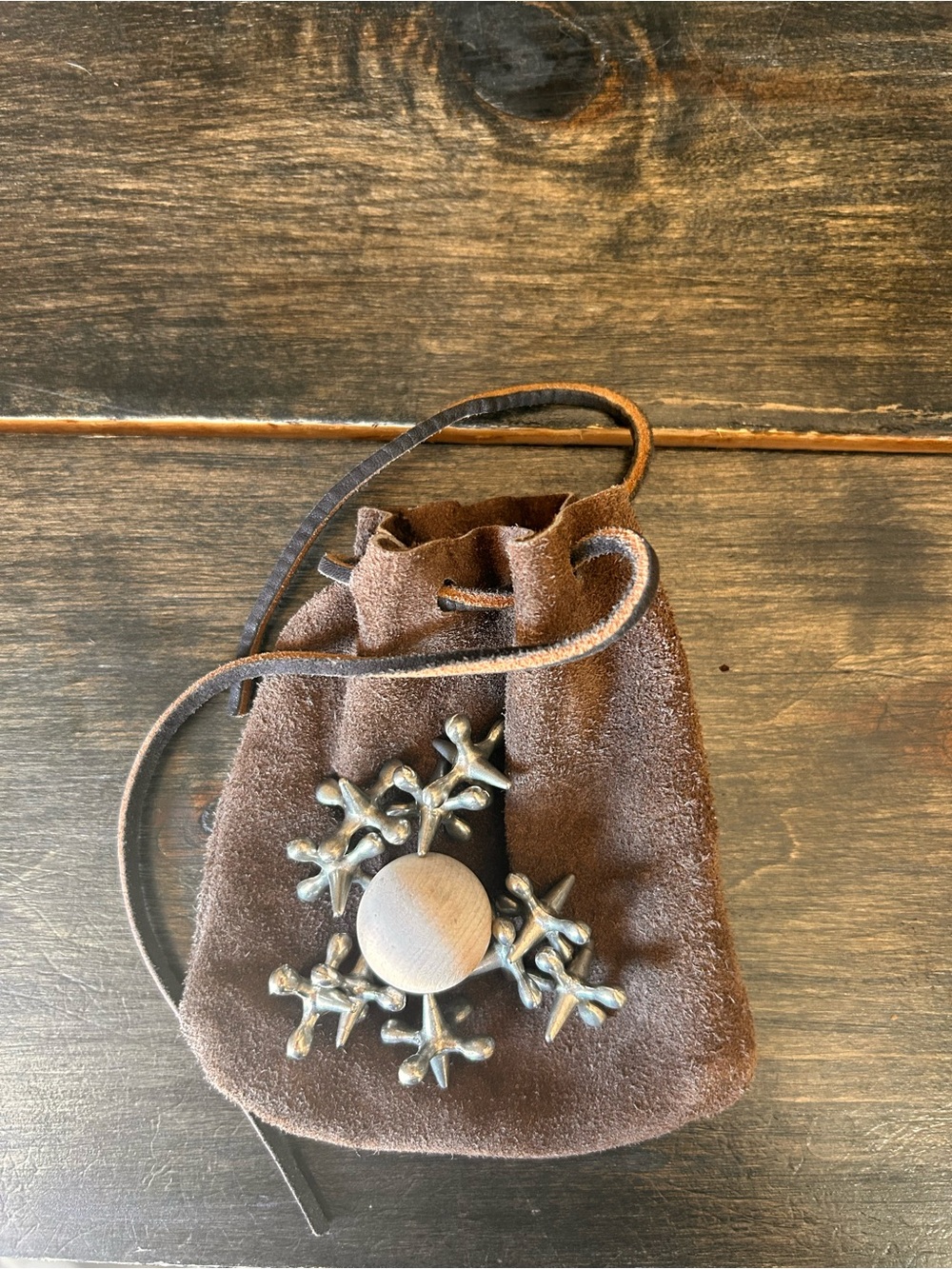 Vintage Brown Jacks Game Suede Drawstring Pouch with metal jacks and wooden ball